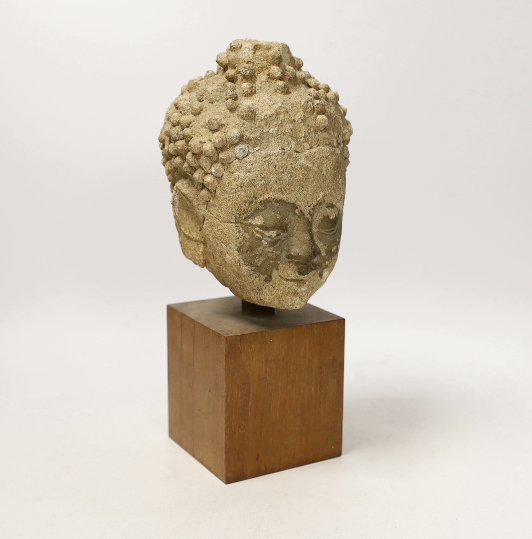 A South East Asian limestone head of Buddha, 29cm